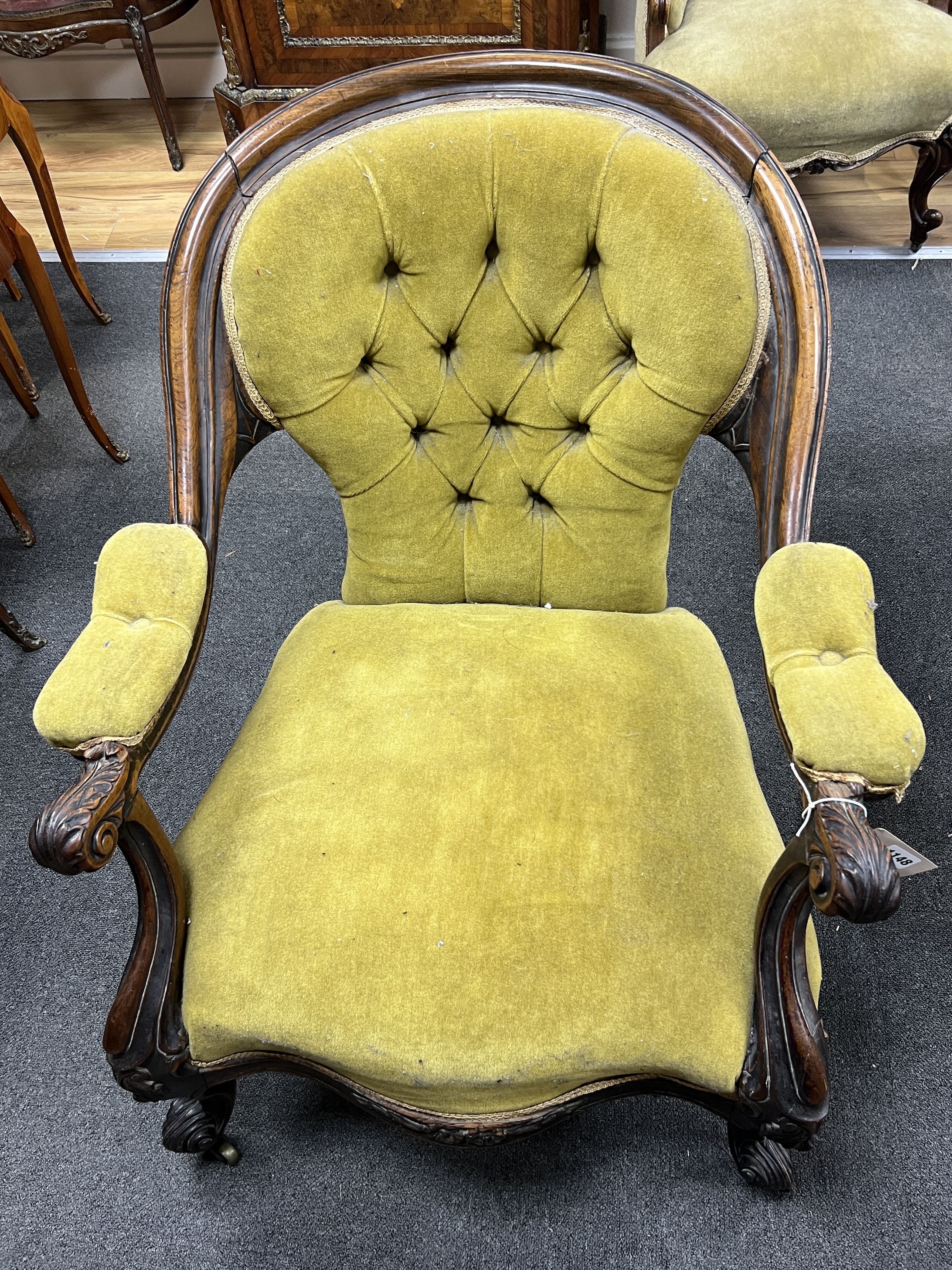 A Victorian rosewood upholstered open armchair, width 71cm, depth 72cm, height 79cm